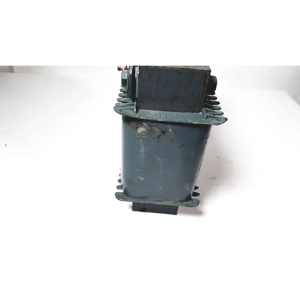 A weathered dark green industrial trafo jordi ch-4950 huttwil transformer with rectangular body and mounting flanges