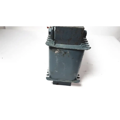 A weathered dark green industrial trafo jordi ch-4950 huttwil transformer with rectangular body and mounting flanges