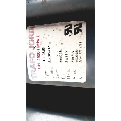 A white label with black and red text showing trafo jordi ch-4950 technical specifications on huttwil transformer dt-175/55