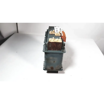 Rusty green metal trafo jordi ch-4950 huttwil transformer with orange terminal blocks and beige insulating caps