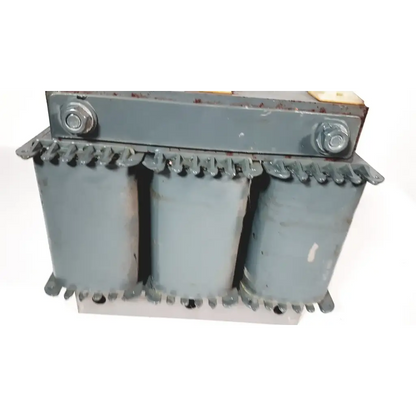 Gray trafo jordi ch-4950 huttwil transformer with three cylindrical cores and bolted metal casing industrial design