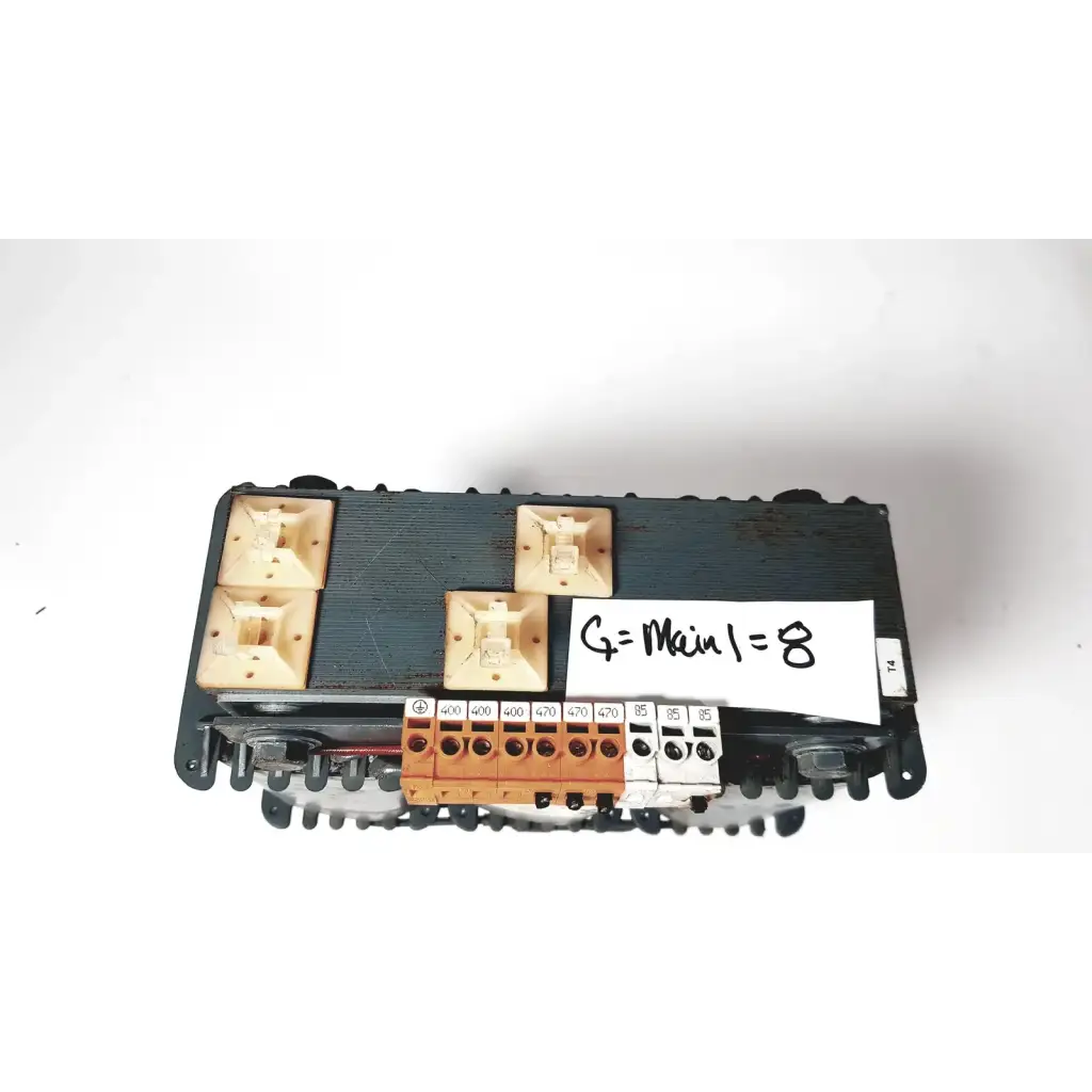 Black plastic electrical terminal block with beige and orange connectors on trafo jordi ch-4950 huttwil transformer