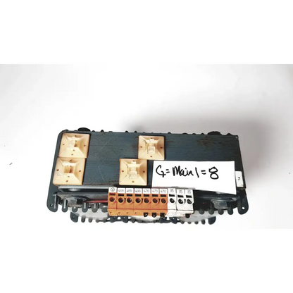 Black plastic electrical terminal block with beige and orange connectors on trafo jordi ch-4950 huttwil transformer