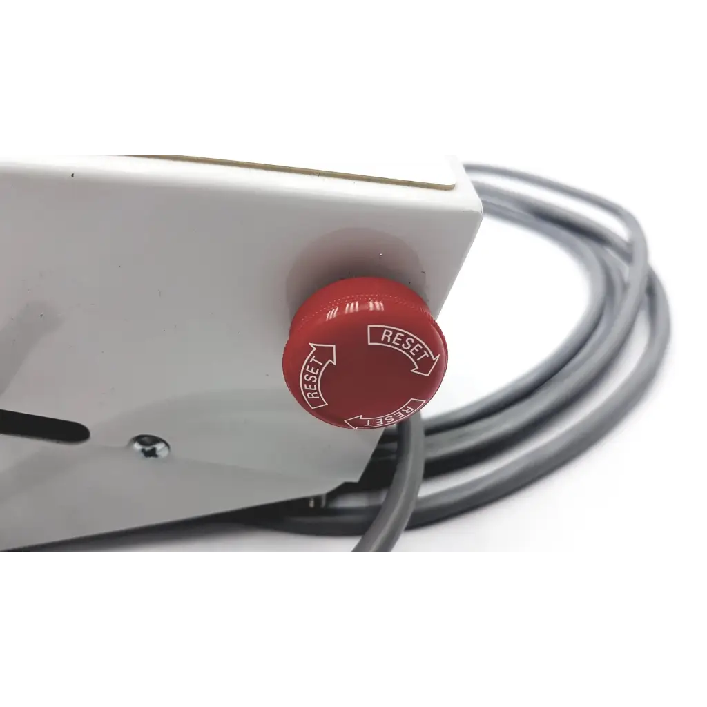 Red circular reset button with white reset text and arrows on white plastic housing of transmotion medical control box 58311-001 rev h