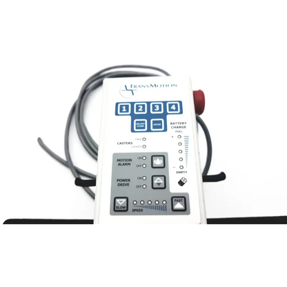 White transmotion medical control box 58311-001 rev h with blue gray buttons battery charge indicator and coiled cables