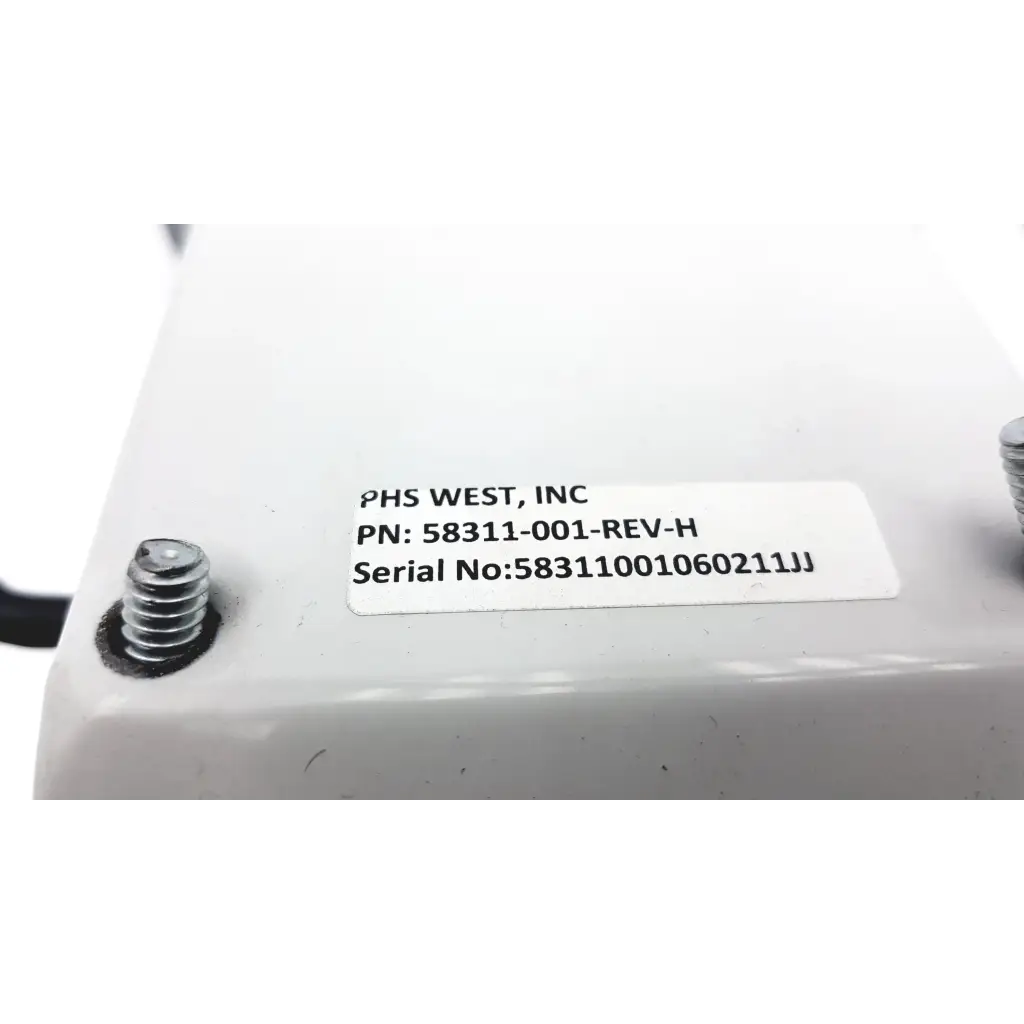 White plastic transmotion medical control box with label phs west inc part number pn 58311-001 rev h