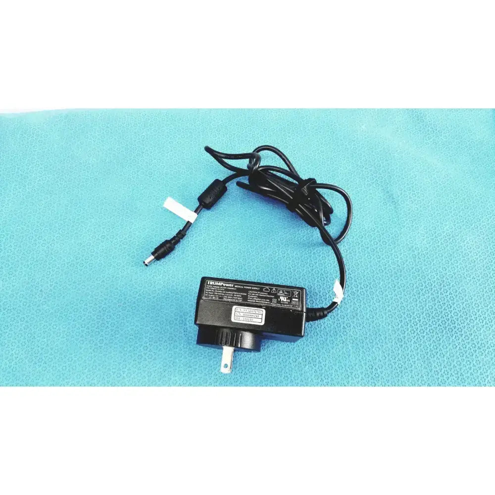 Black plastic trumpower medical power supply adapter fsp015-rcmm with coiled cable usb-a and two-prong plug