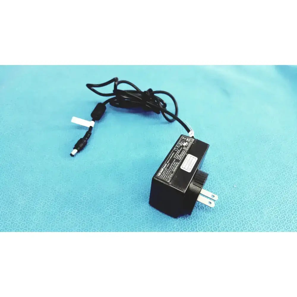 Black rectangular fsp015-rcmm trumpower medical power supply adapter with coiled cable and cylindrical connector 12v 1.25a