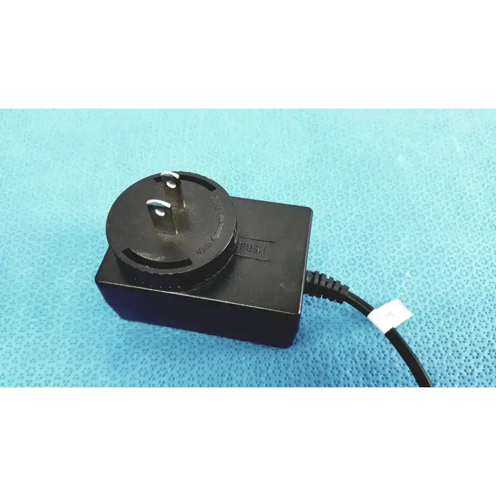 Black rectangular trumpower medical power supply fsp015-rcmm adapter with circular plug and two metallic prongs and cord