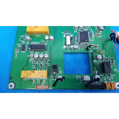 Green printed circuit board with yellow capacitors black integrated circuits and silver resistors video interface circuit board for topcon retinal camera