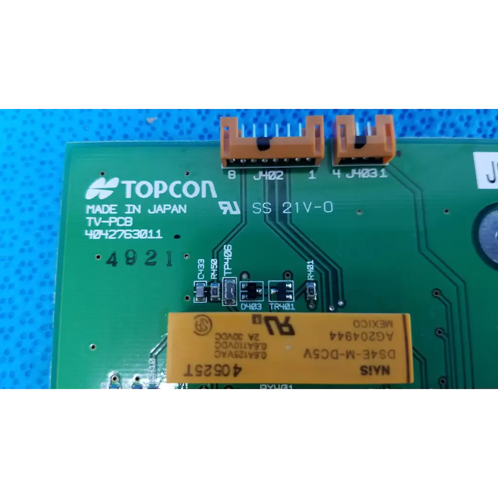 Green topcon tv-pcb video interface circuit board with orange connectors and yellow label for retinal camera use