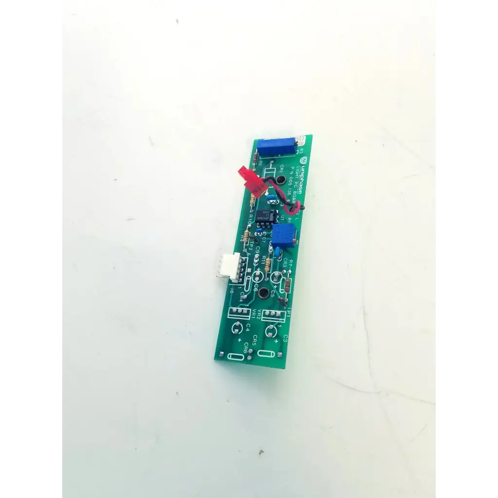 Green light pc board with blue red connectors black integrated circuits and white labeling uniphase light bbcb3-9d