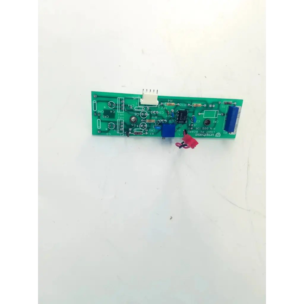 Green printed circuit board with electronic components and blue connector for uniphase light pc board 005-136 bbcb3-9d 22523sm