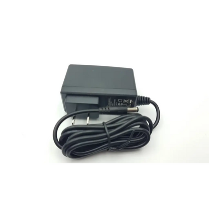 Black plastic UpBright adapter xtd-1501000 ac5-383 with coiled power cord and european-style plug for versatile use