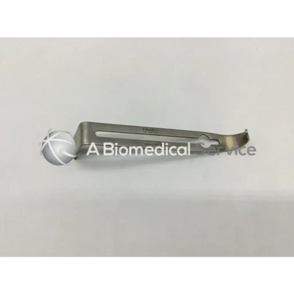 Silver v.mueller ch 1030-003 retractor instrument with curved metallic handle and adjustable clamping mechanism