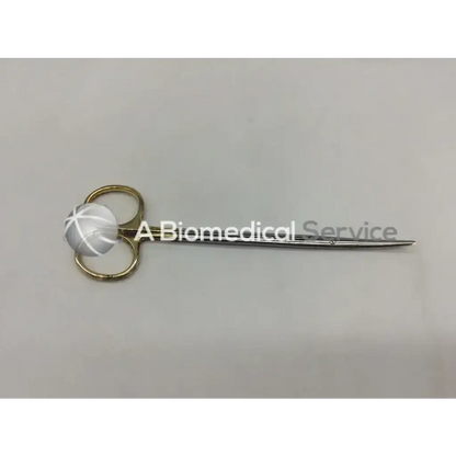 A pair of mueller mo1601 forceps surgical scissors with gold handles and shiny metallic blades for precise cutting