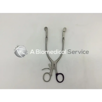 Silver surgical collis retractor ad5-63 with black handled grips and curved u shaped stainless steel design