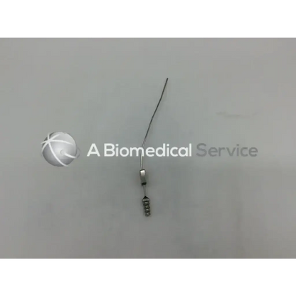 A slender metallic mcculloch 5fr suction tube with a fine wire shaft and a cylindrical handle with three notches