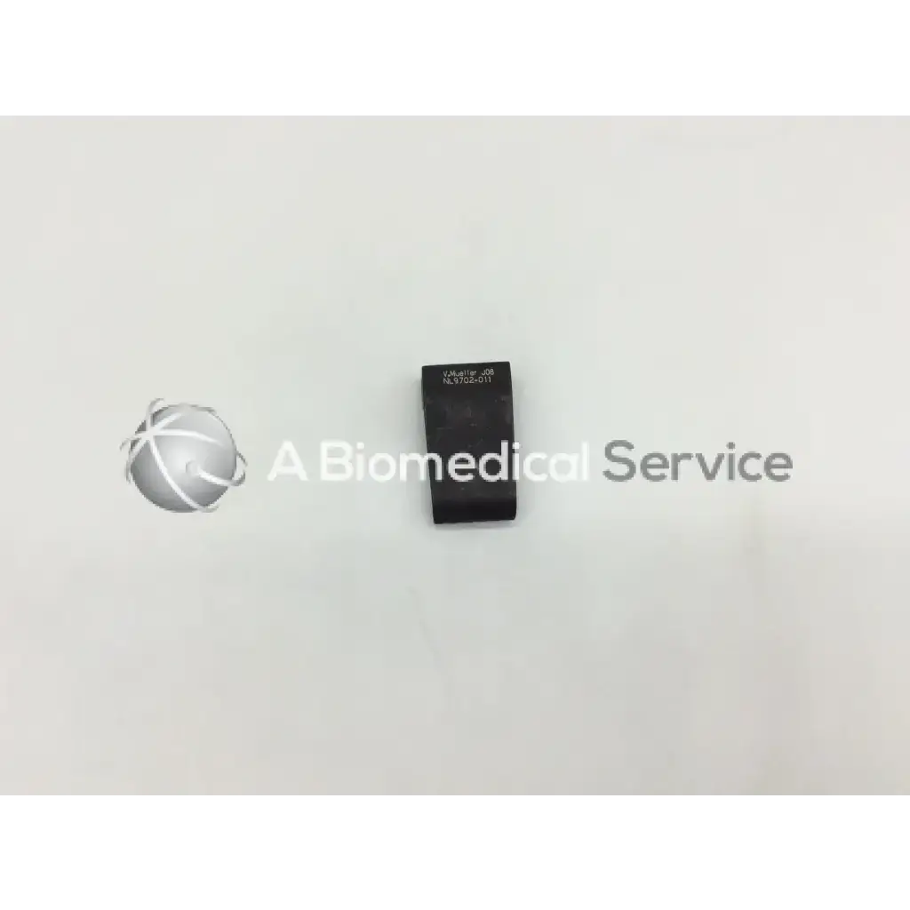 Black rectangular mueller nl9702-011 retractor blade with engraved text designed for surgical use