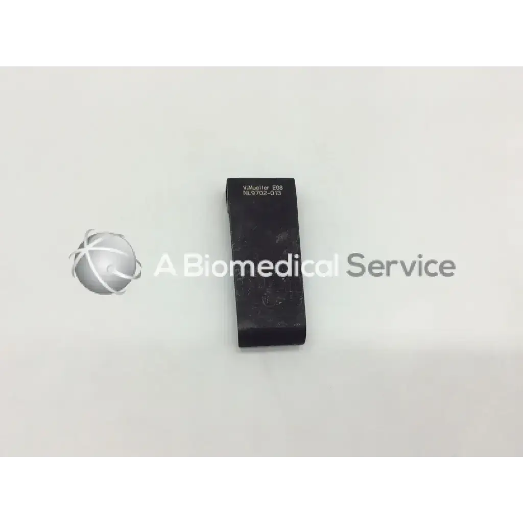 Black rectangular v mueller mcculloch retractor blade nl9702-013 with engraved text and textured surface