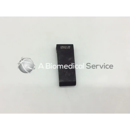 Black rectangular v mueller mcculloch retractor blade nl9702-013 with engraved text and textured surface