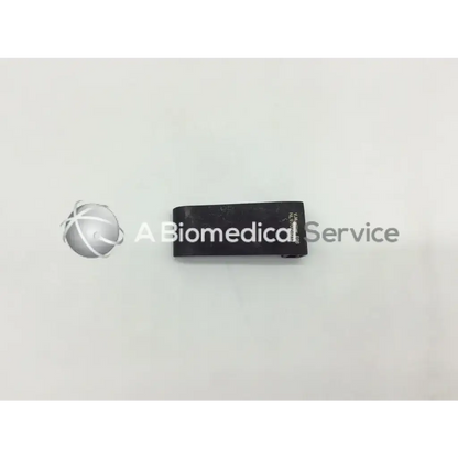 Black matte rectangular v mueller mcculloch retractor blade with engraved text on side for surgical use