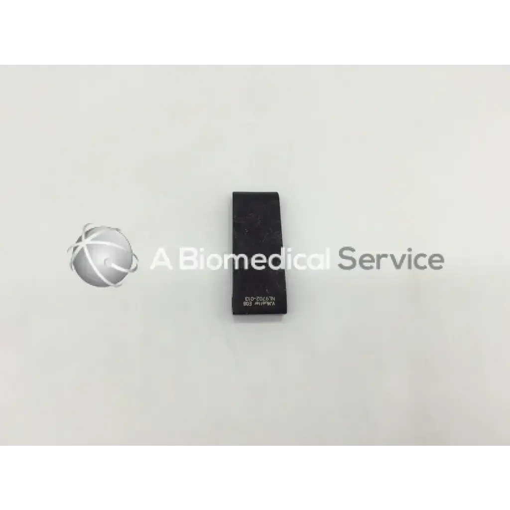 Black rectangular V Mueller mcculloch retractor blade NL9702-013 with engraved text on its surface