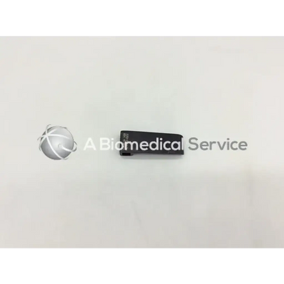 Black rectangular v mueller nl9702-022 retractor blade with matte finish and engraved text on the side