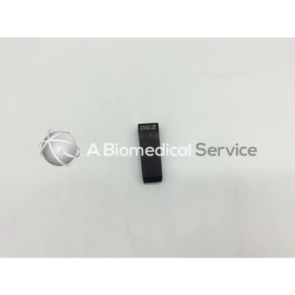 Black rectangular mueller nl9702-022 retractor blade with engraved text on its surface for surgical use