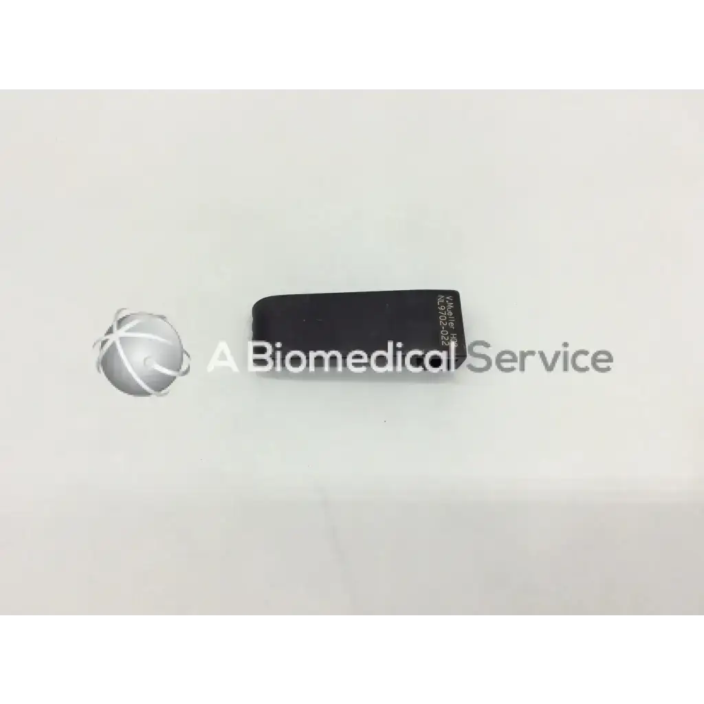 Black rectangular metal retractor blade with engraved mueller nl9702-022 retractor text on surface for surgical use