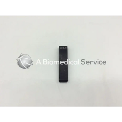 Black rectangular mcculloch retractor blade 2cm x 8cm with engraved text on top surface for surgical use