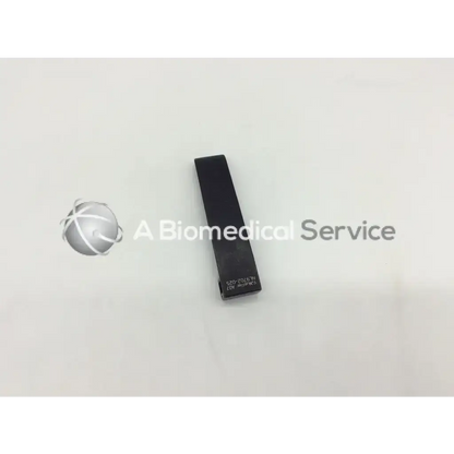 Black rectangular mcculloch retractor blade 2cm x 8cm with engraved text on surface for surgical use