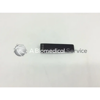 Black rectangular mcculloch retractor blade 2cm x 8cm with engraved text on surface for surgical use