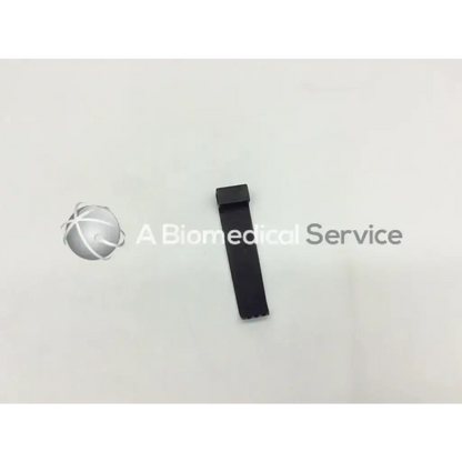 Black rectangular mcculloch retractor blade with flat top serrated edge measuring 2cm x 8cm for surgical use