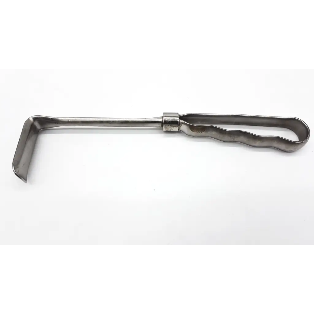 Silver v.mueller richardson appendectomy retractor with wavy handle and curved blade designed for appendectomy use