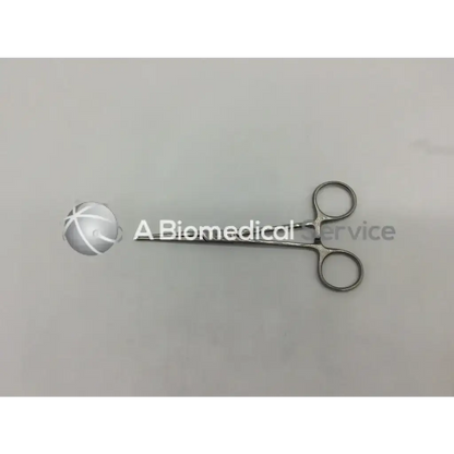 Silver surgical clamp with rounded handles and polished finish mueller su2790 forceps for precise medical use