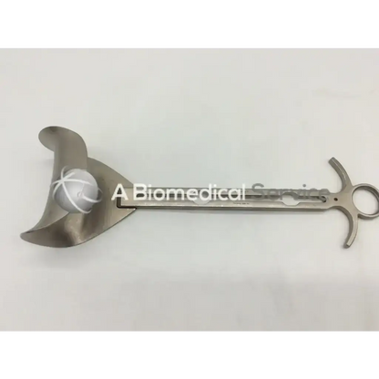 Silver mueller su3021 balfour center surgical blade with curved leaf handle and white thread wrapped spherical component