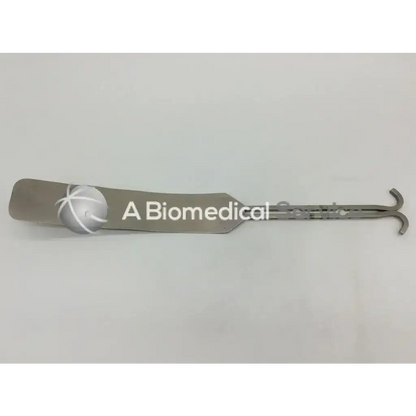Silver metallic v mueller su3032 surgical dixon center blade with curved handle and embossed logo on flat rounded blade end
