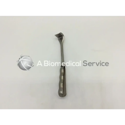 A sleek metallic mueller su3472 retractor with curved tip and textured grip handle for surgical use