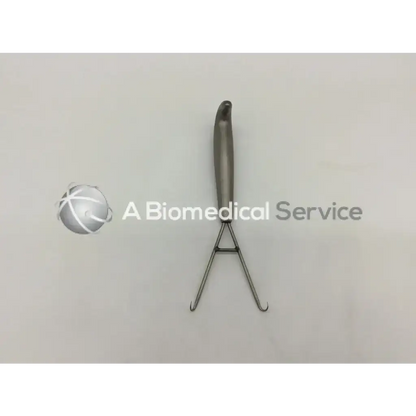 Silver stainless steel mueller su3600 berens retractor with curved handle and two angled hook-like prongs