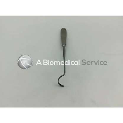 A sleek metallic su3992 deschamps ligature carrier with a straight handle and curved looped tip for surgical use