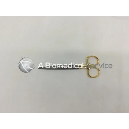A pair of mueller surgical vital mayo dissecting scissors with gold-colored handles and a metallic blade