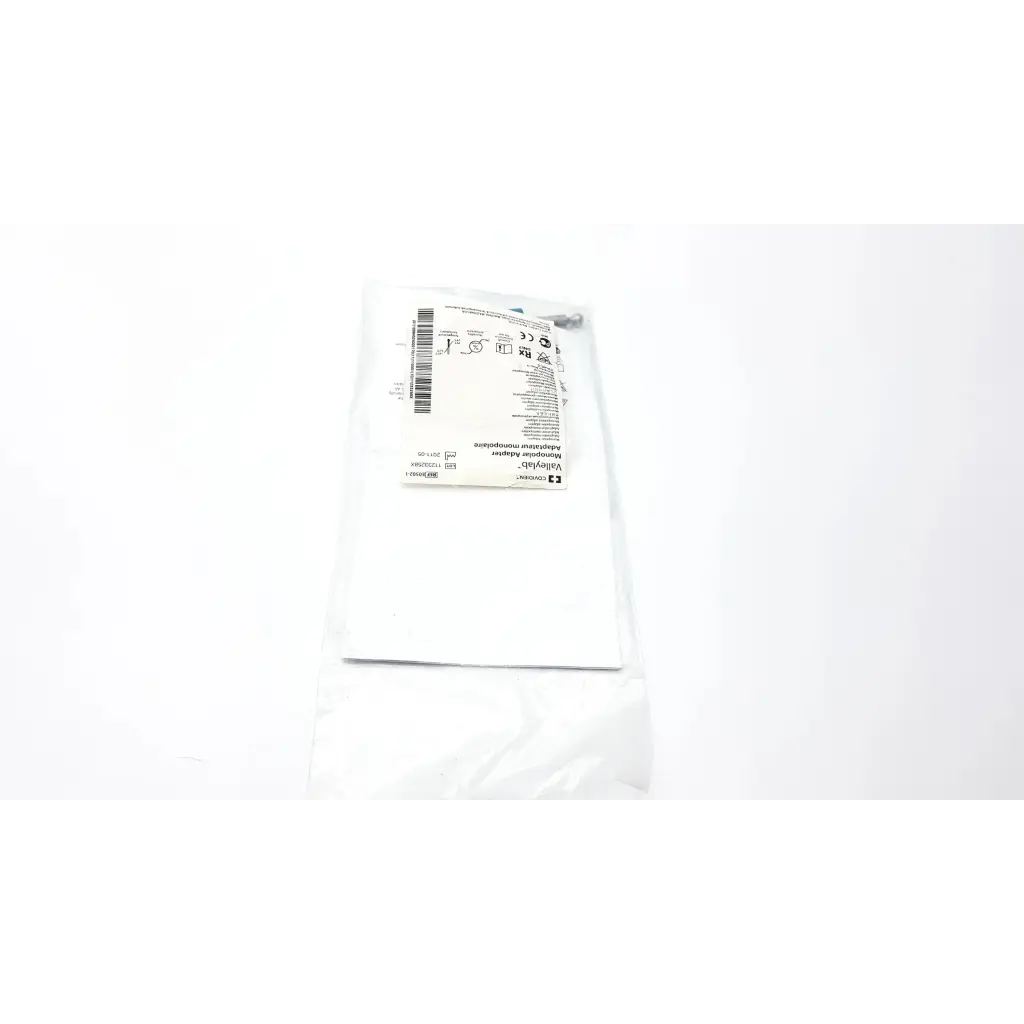 White sterile surgical drape in clear plastic packaging labeled valleylab e0502 universal monopolar adapter product