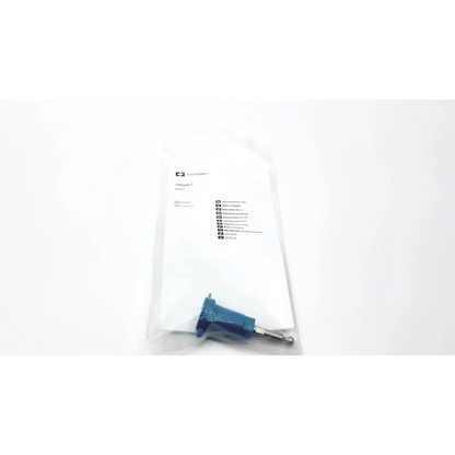 Blue plastic Valleylab E0502 universal monopolar adapter with metallic pin in clear bag labeled vollmer