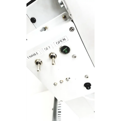 White control panel with silver toggle switches and green indicator on varian turbo-v 301-ag navigator vacuum pump system