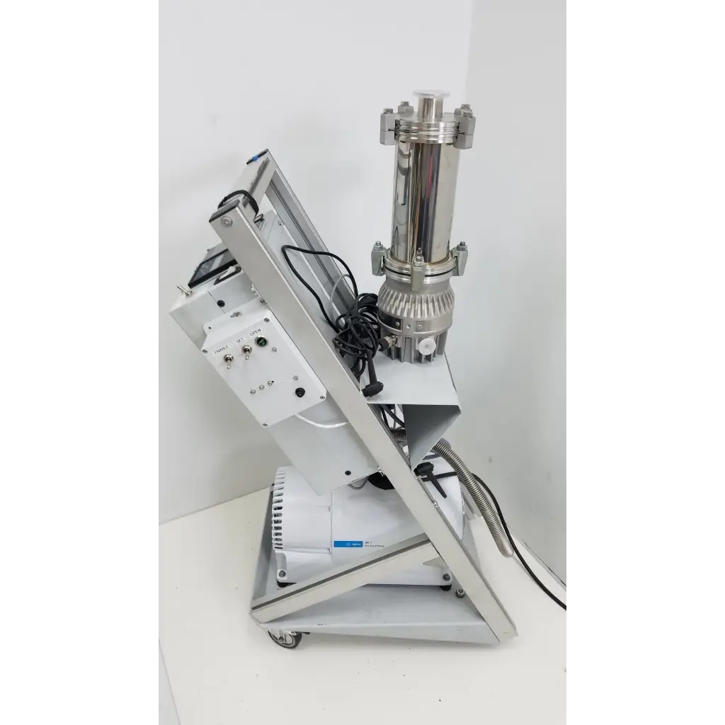 Silver stainless steel turbo-v 301-ag navigator vacuum pump system with control panel mounted on white metal cart with wheels