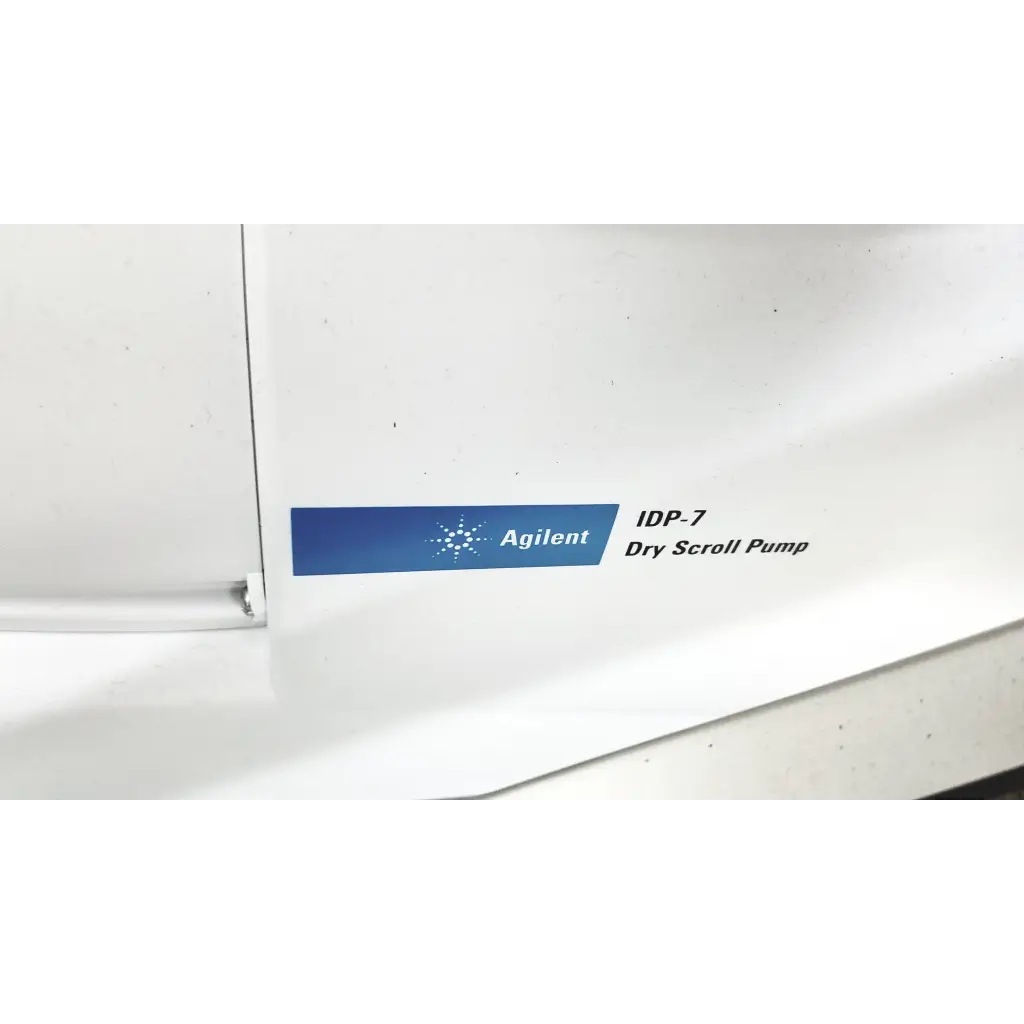 White agilent idp-7 dry scroll pump with blue label and logo in varian turbo-v 301-ag navigator vacuum pump system