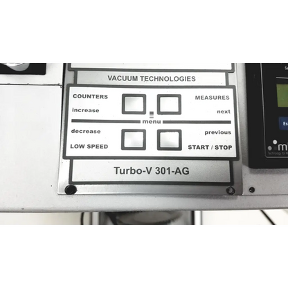 Silver control panel with black labels and buttons on the varian turbo-v 301-ag navigator vacuum pump system