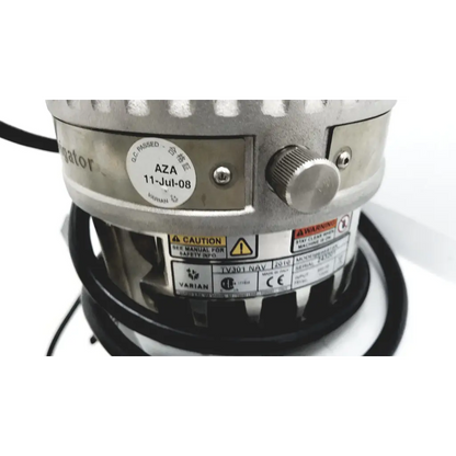 Silver metallic industrial fan motor with textured knob and certification stickers on turbo-v 301-ag navigator vacuum pump system
