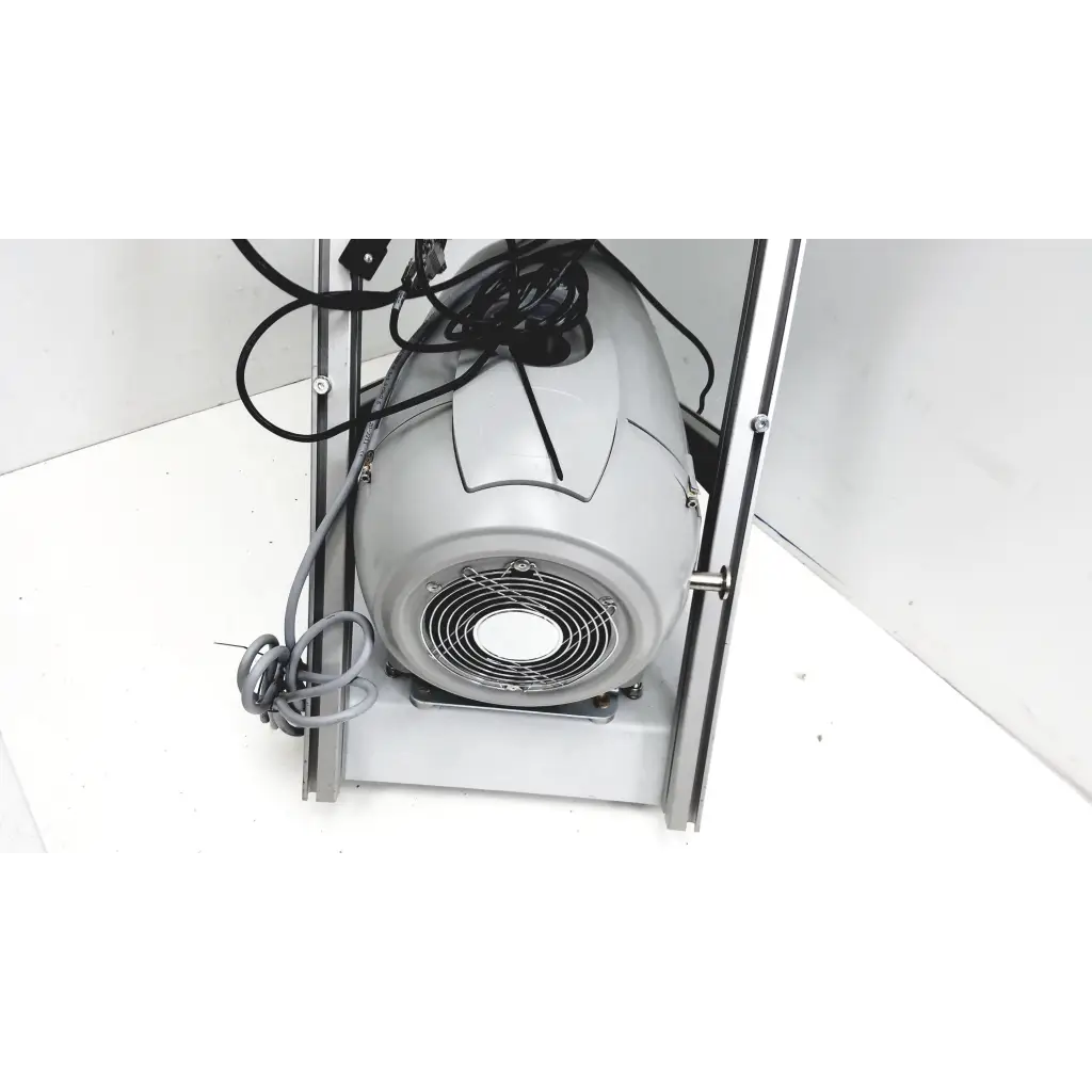 Gray industrial fan with circular grille and coiled black cords on turbo-v 301-ag navigator vacuum pump system back side